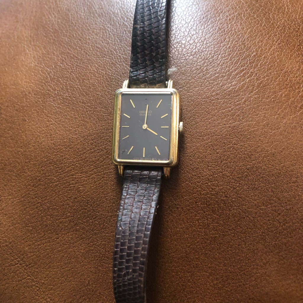 Elegant Gold Rectangular Watch With Black Leather Strap